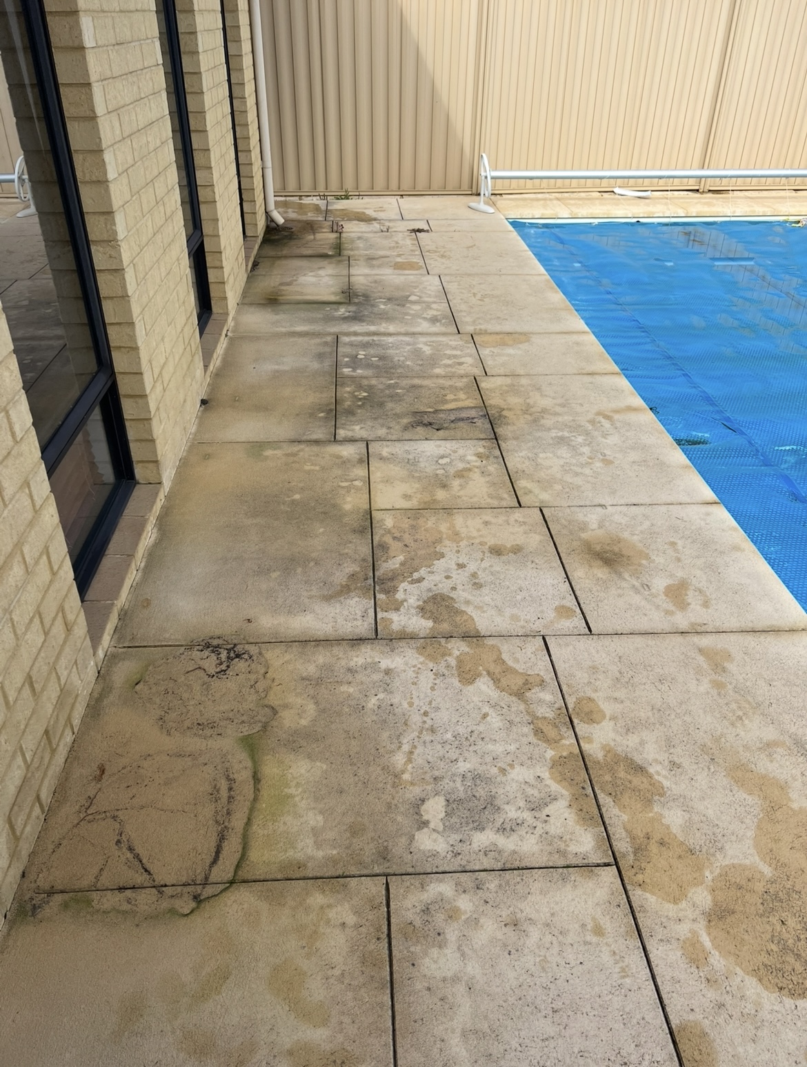 Liquid limestone Liquid limestone pool area before — pressure cleaning Darch Perth WA