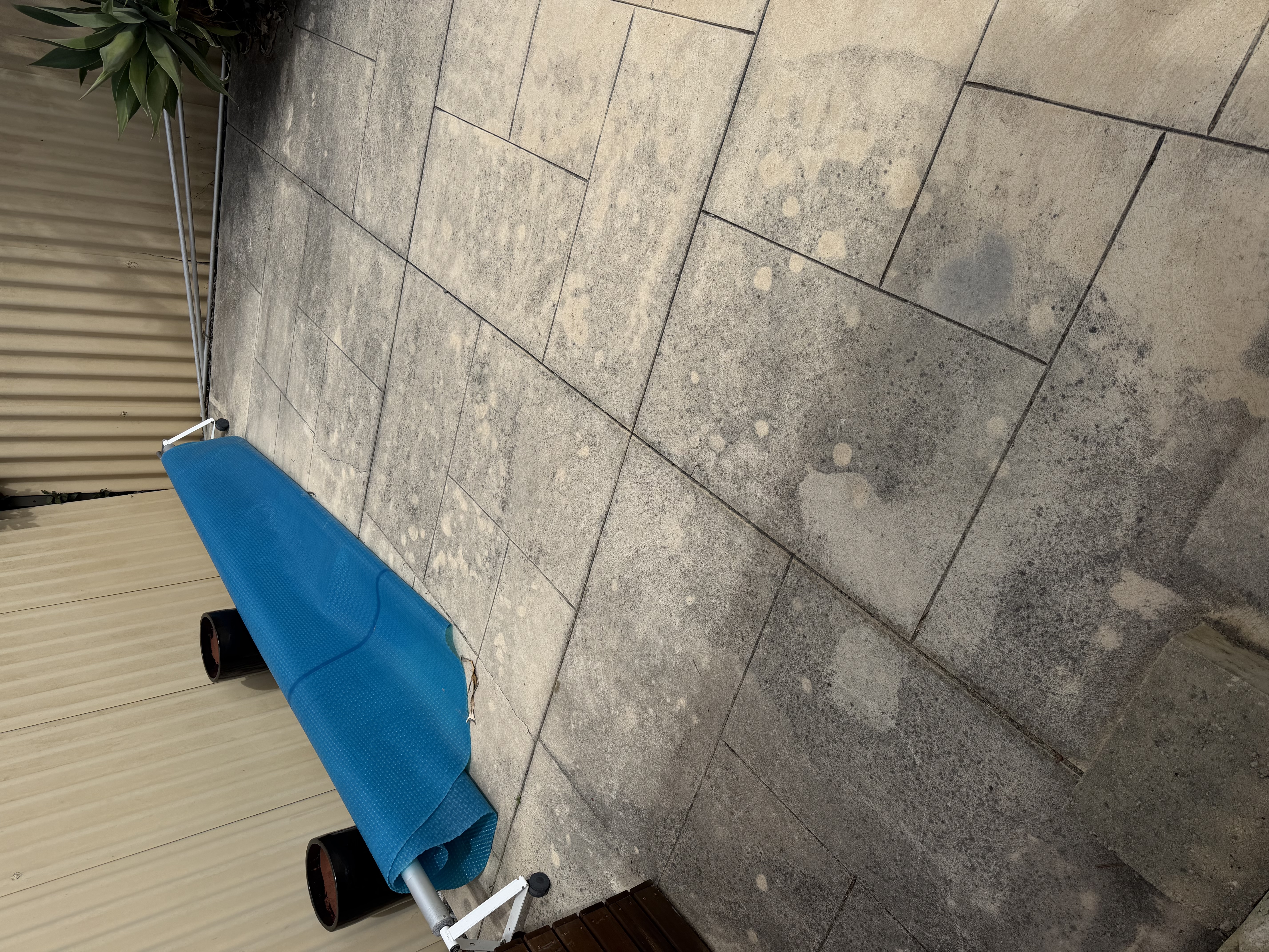 Liquid limestone Large format patio tiles before — pressure cleaning Gwelup Perth WA