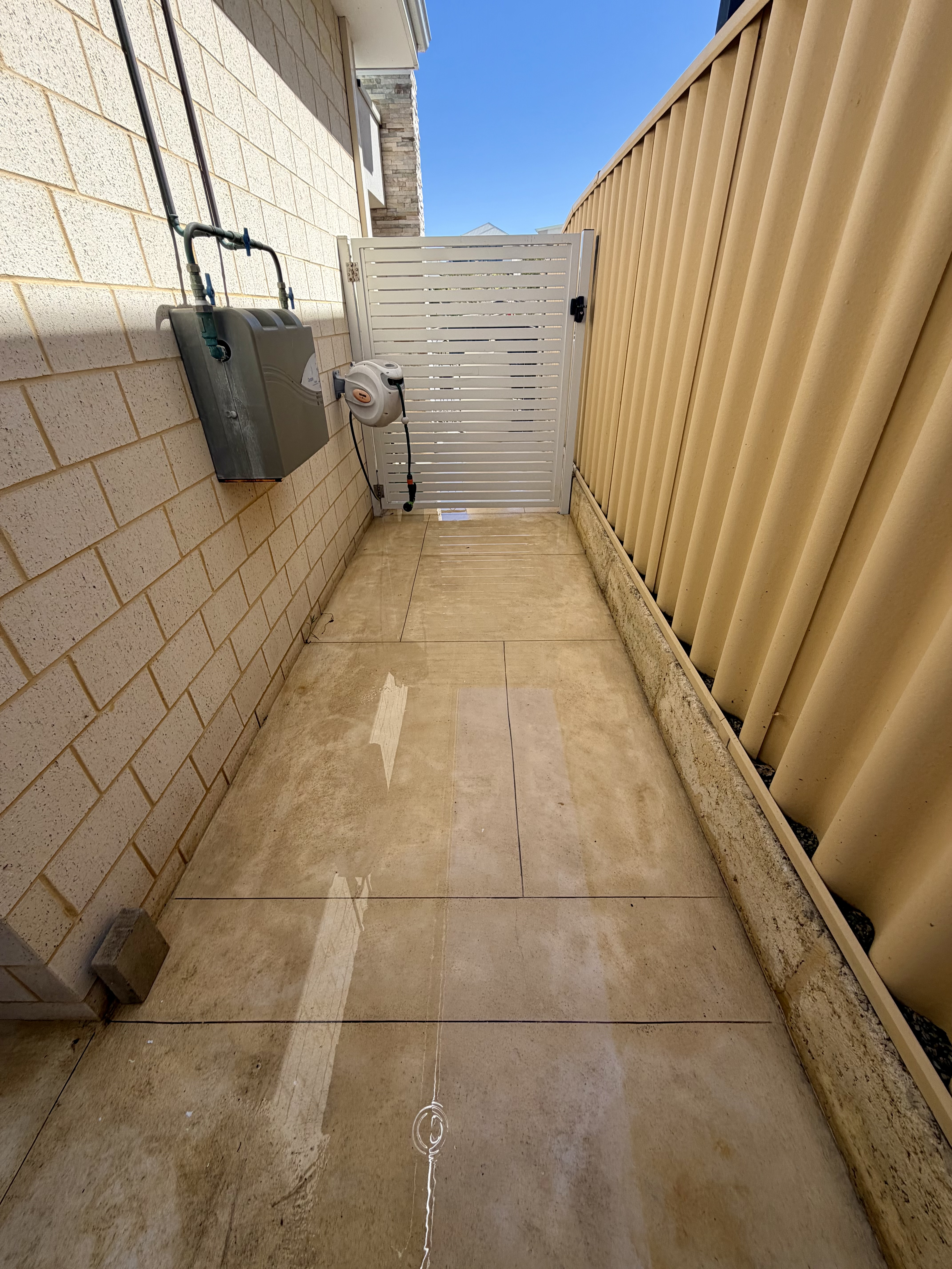 Liquid limestone Concrete side passage after — pressure cleaning Burns Beach Perth WA