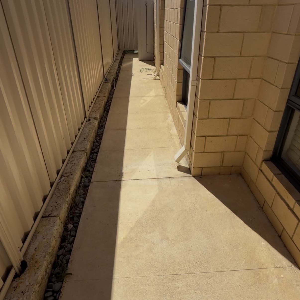 Liquid limestone Concrete side passage after — pressure cleaning Burns Beach Perth WA