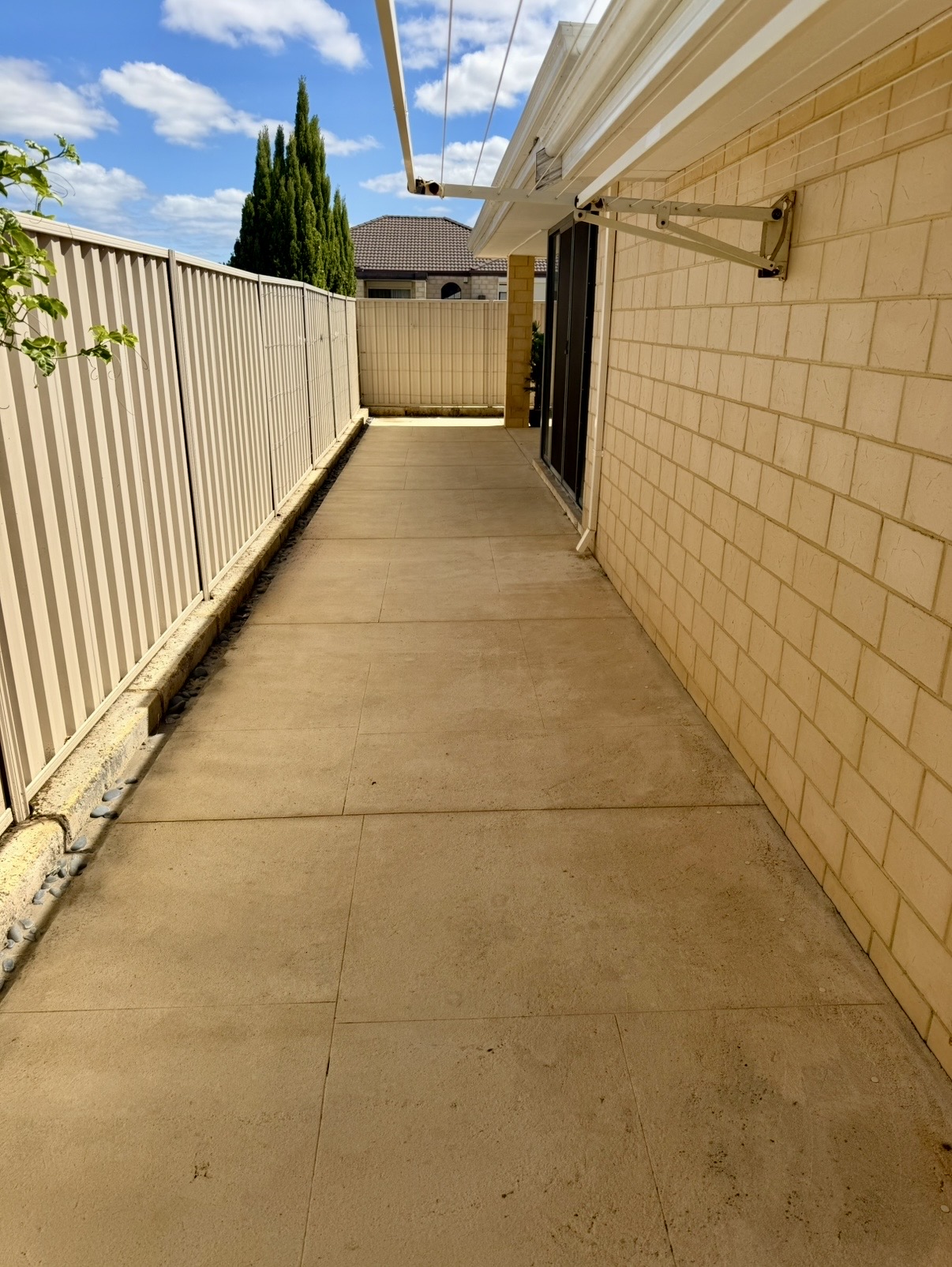 Liquid limestone Concrete side passage before — pressure cleaning Butler Perth WA