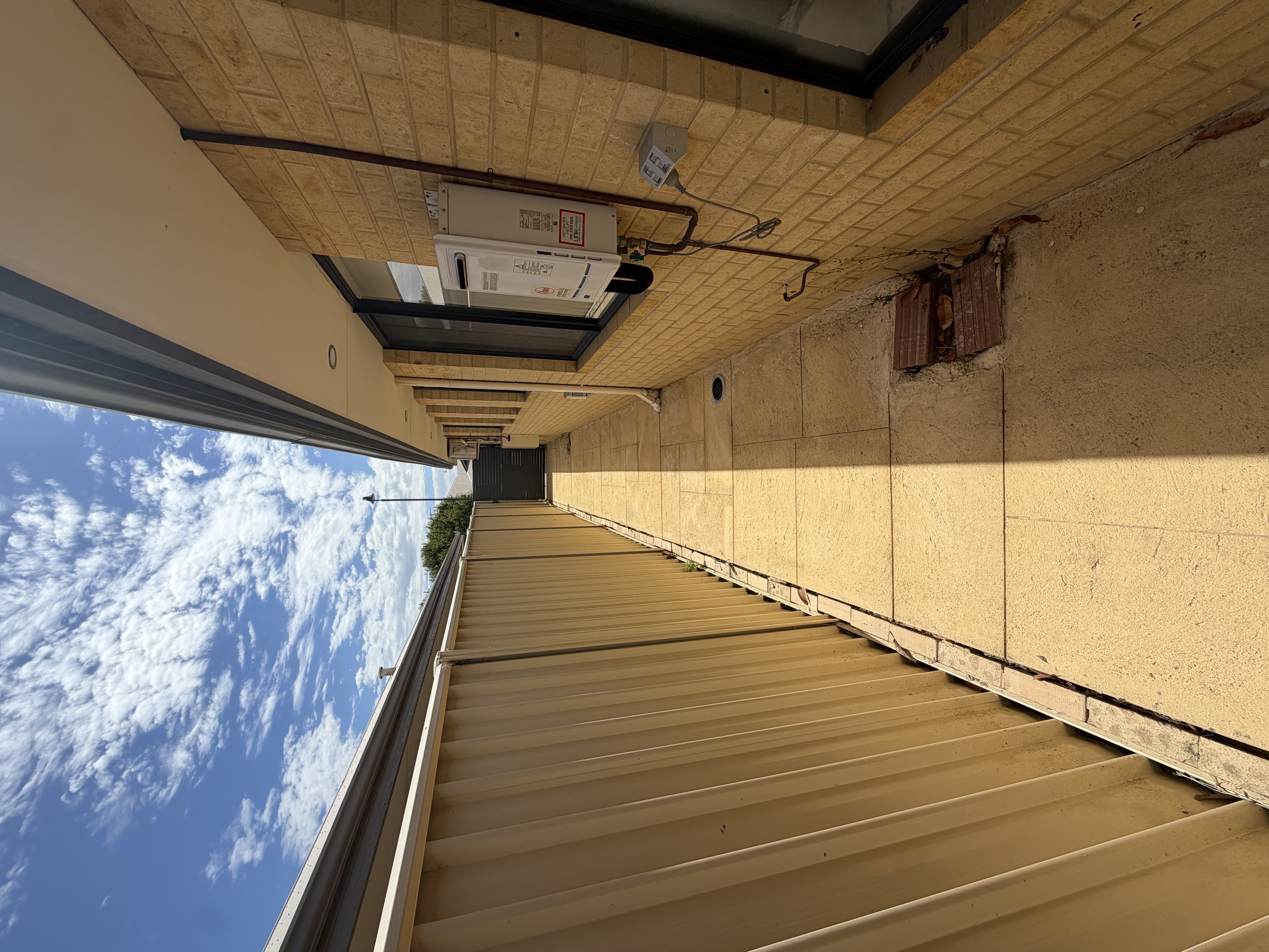 Liquid limestone Long concrete side passage after — pressure cleaning Mindarie Perth WA