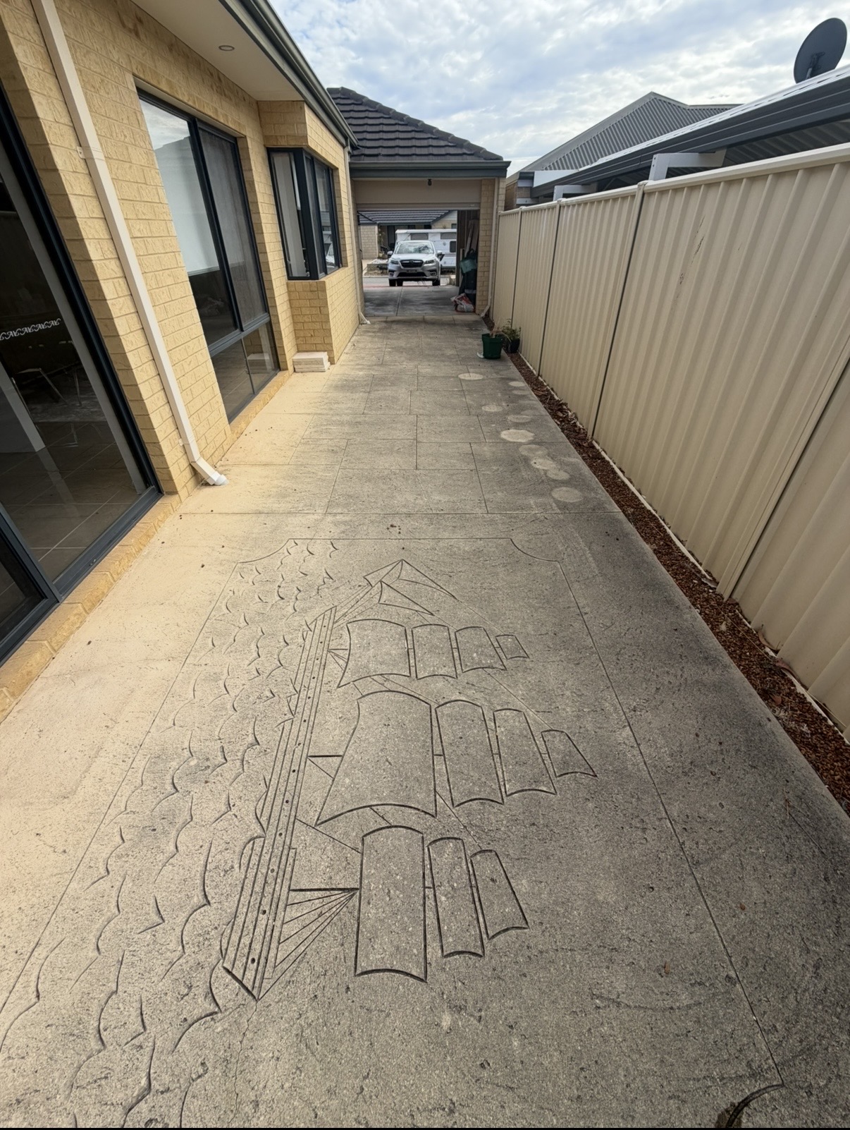 Liquid limestone Decorative stamped concrete alley before — pressure cleaning Tapping Perth WA
