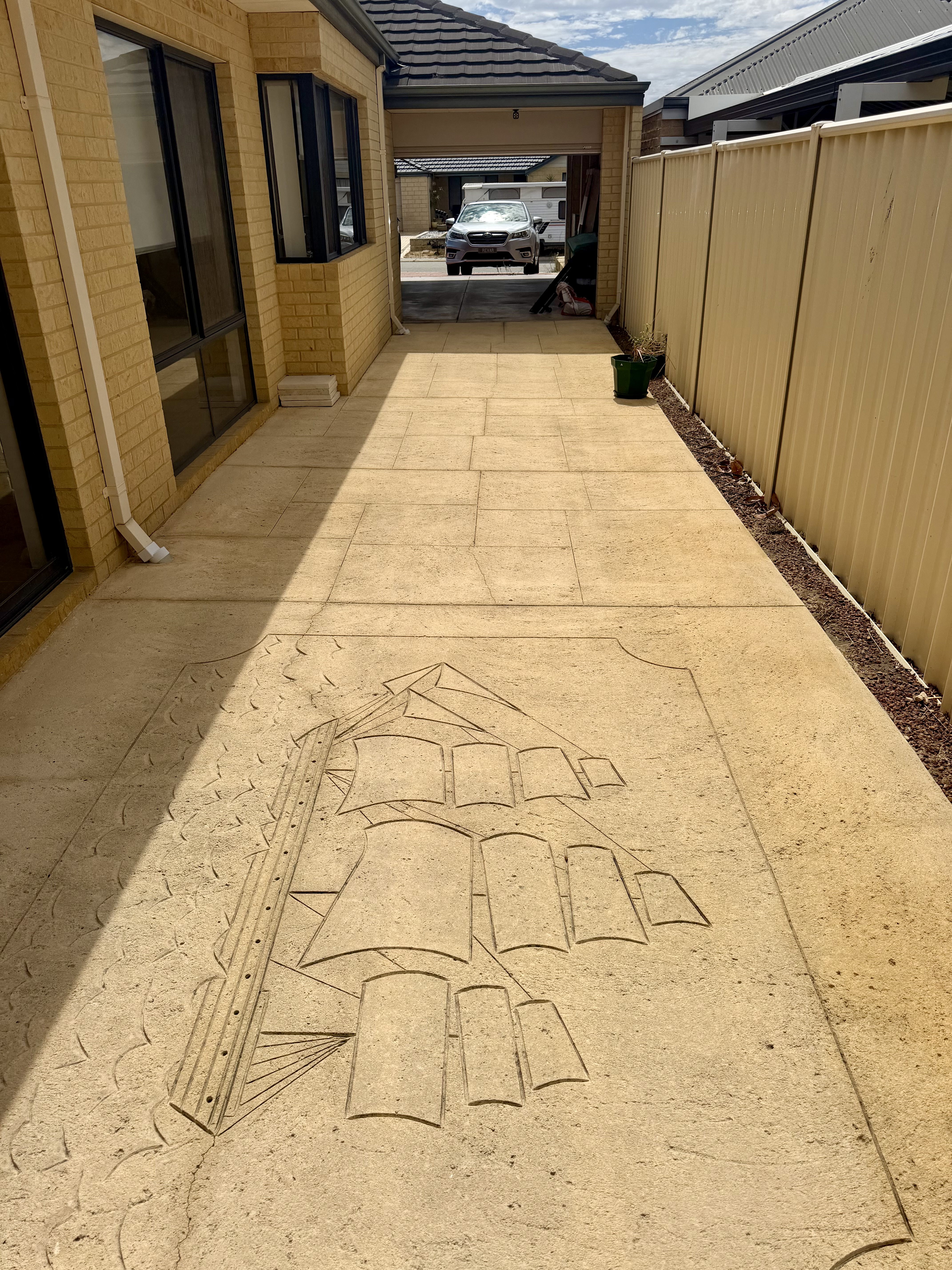 Liquid limestone Decorative stamped concrete alley after — pressure cleaning Tapping Perth WA