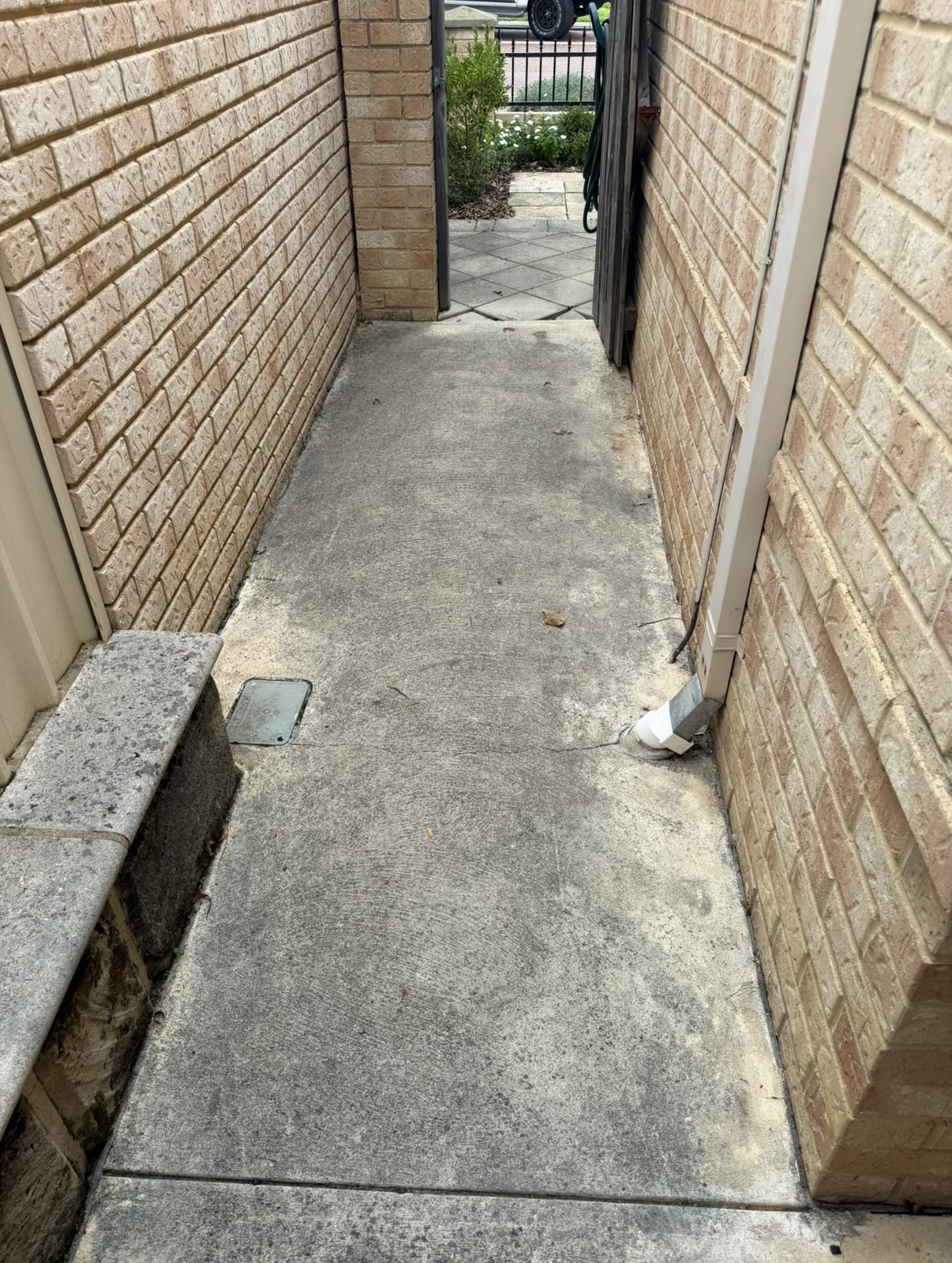 Liquid limestone Concrete narrow passage before — pressure cleaning Joondalup Perth WA