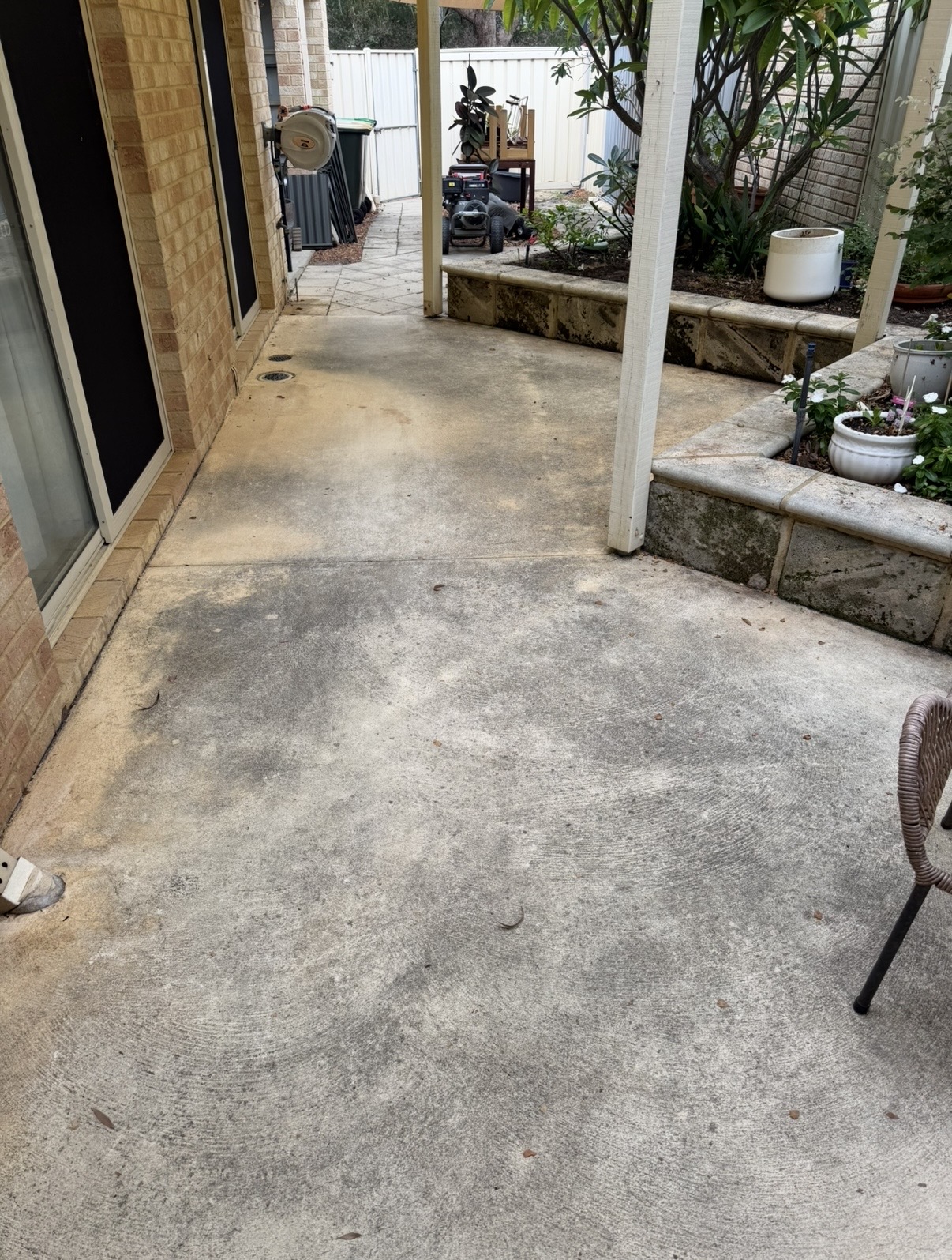 Liquid limestone Covered alfresco concrete before — pressure cleaning Joondalup Perth WA