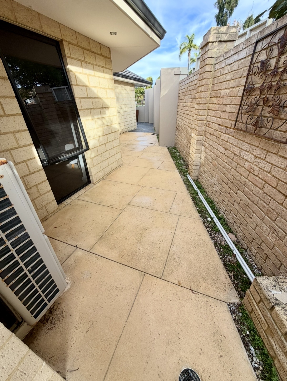 Liquid limestone Limestone tile side passage after — pressure cleaning Karrinyup Perth WA