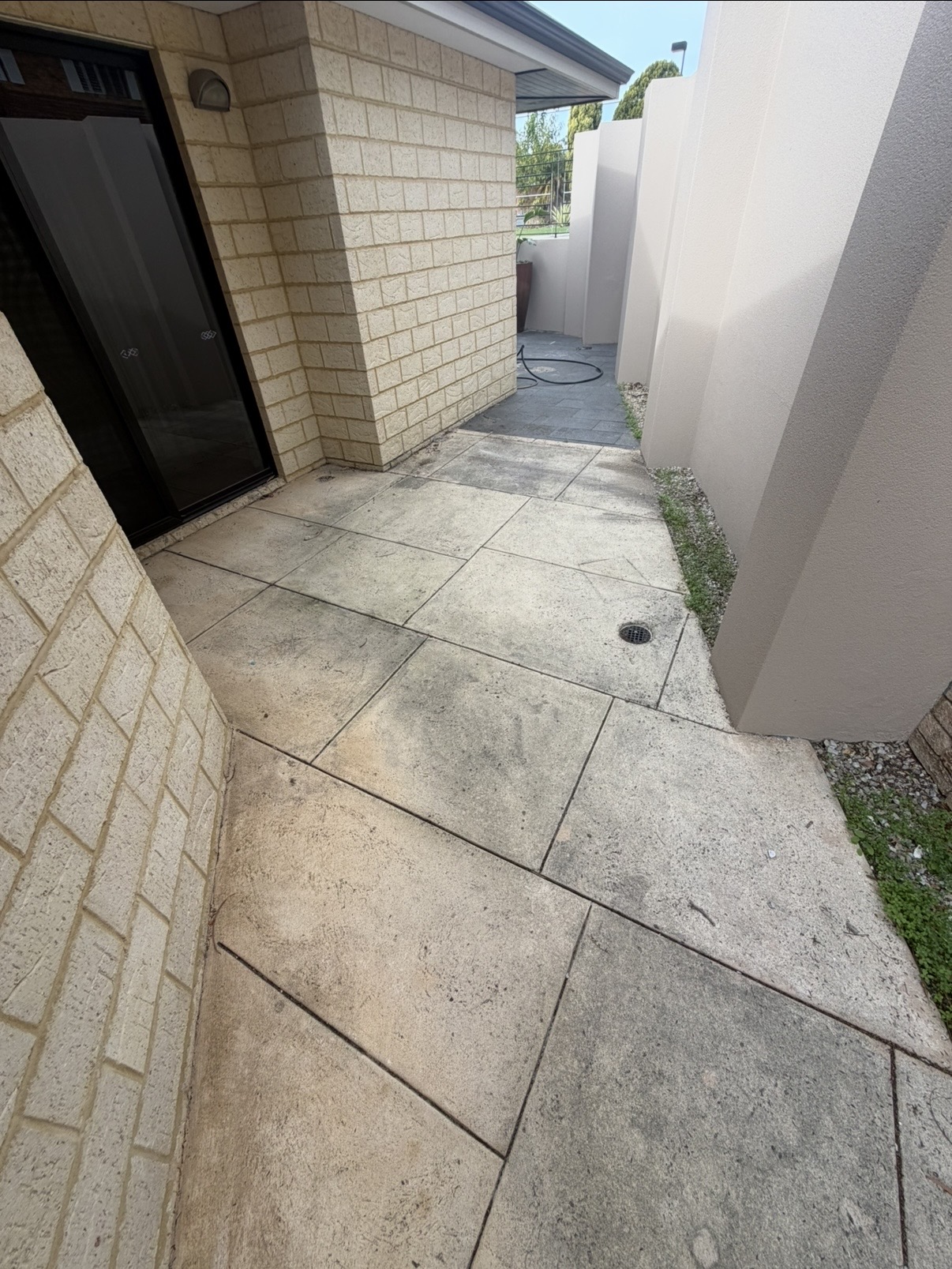 Liquid limestone Limestone tile side passage before — pressure cleaning Karrinyup Perth WA