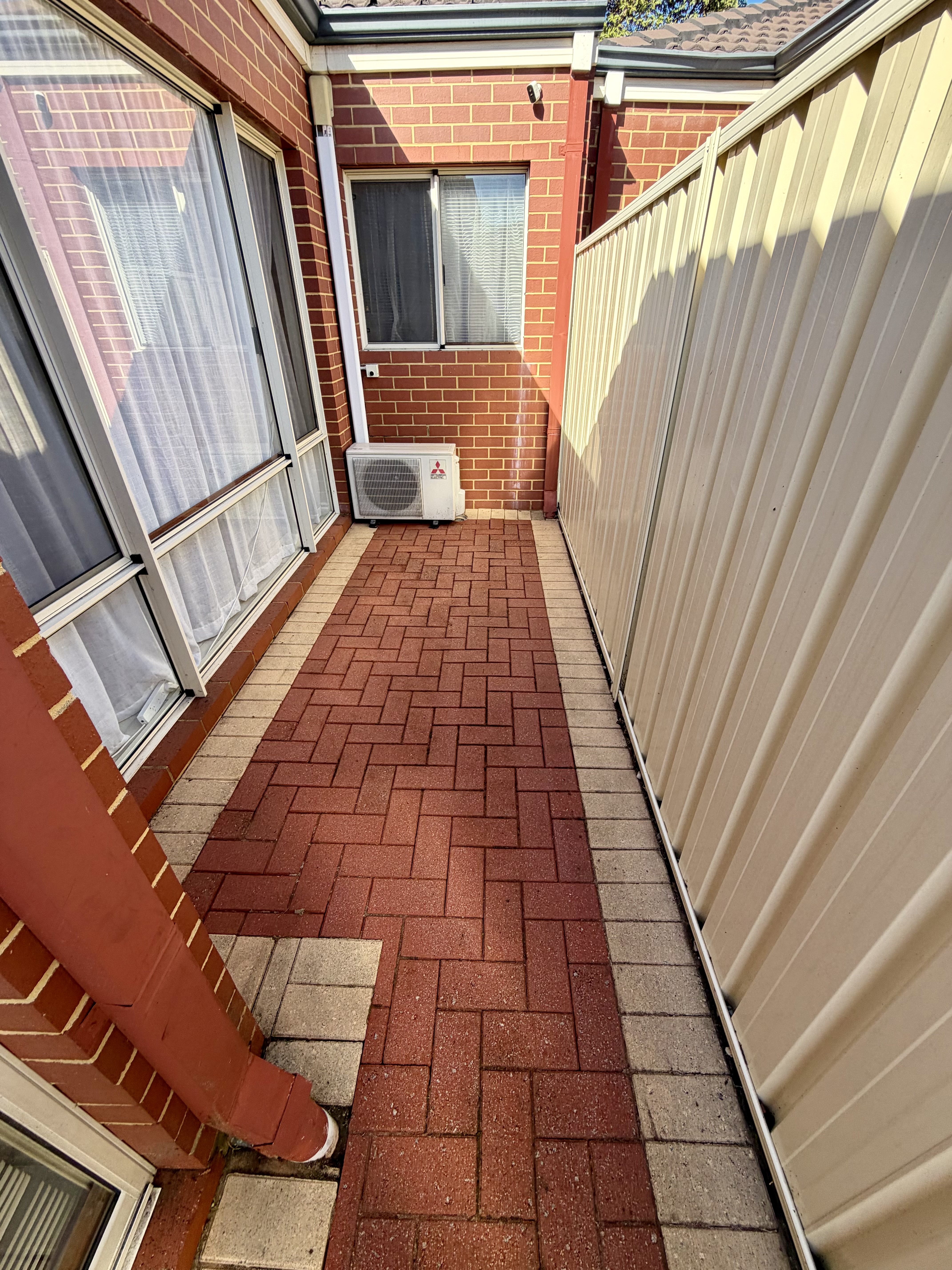 Brick pavers Brick paver side passage after — pressure cleaning Belmont Perth WA